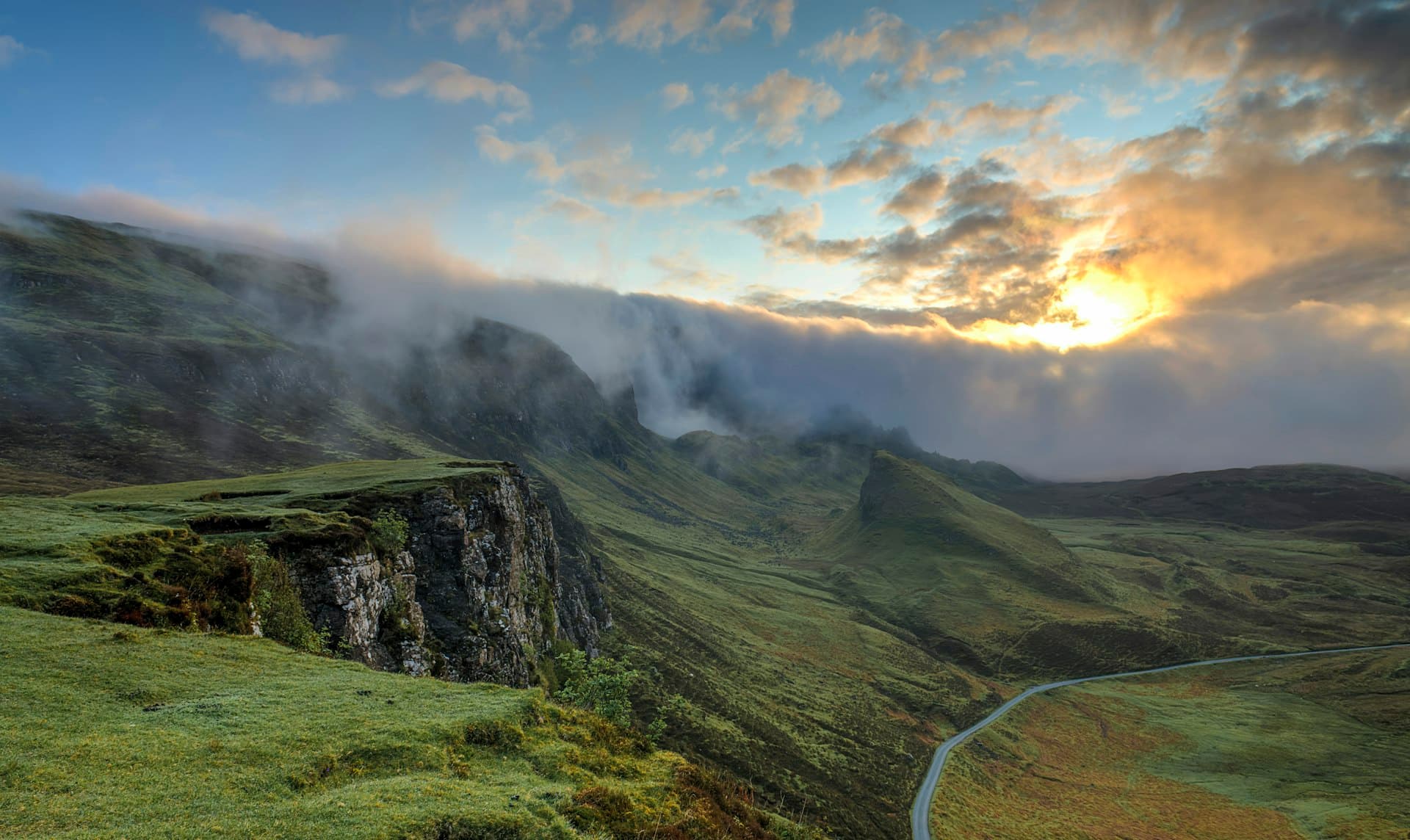 Misty mountain valley at sunrise representing a new beginning