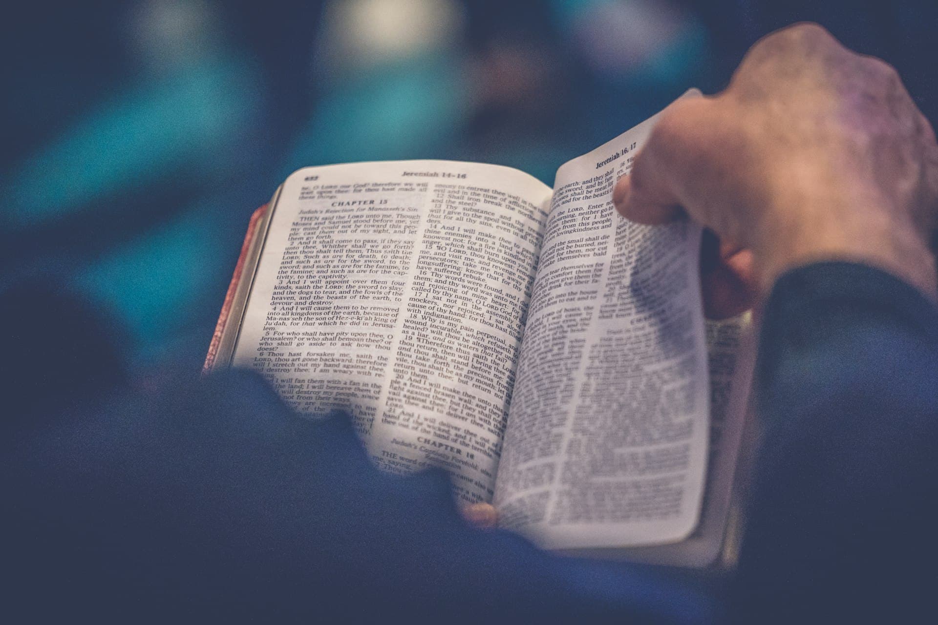 A well-worn Bible held open in someone's hands