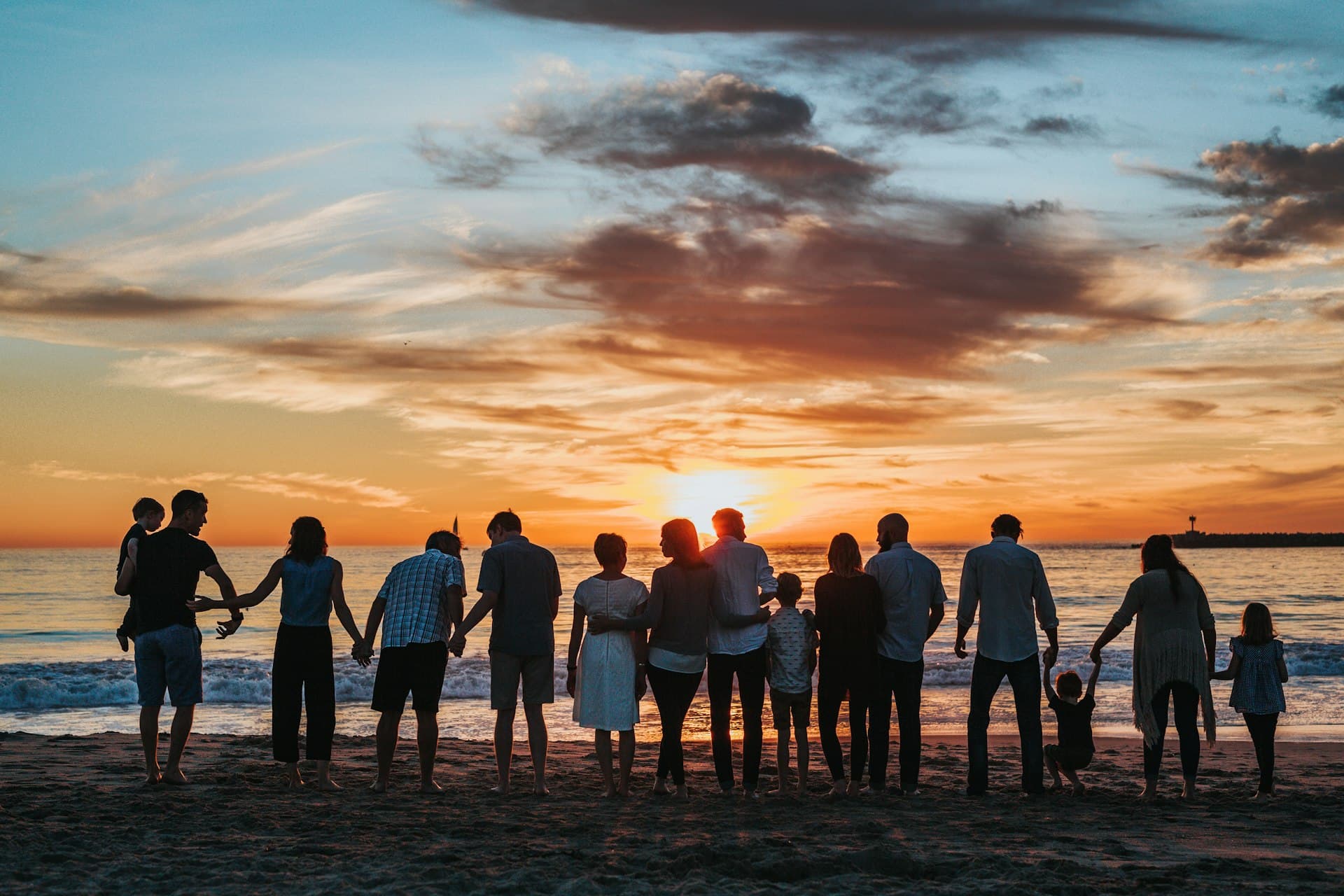 Family walking together on the beach
